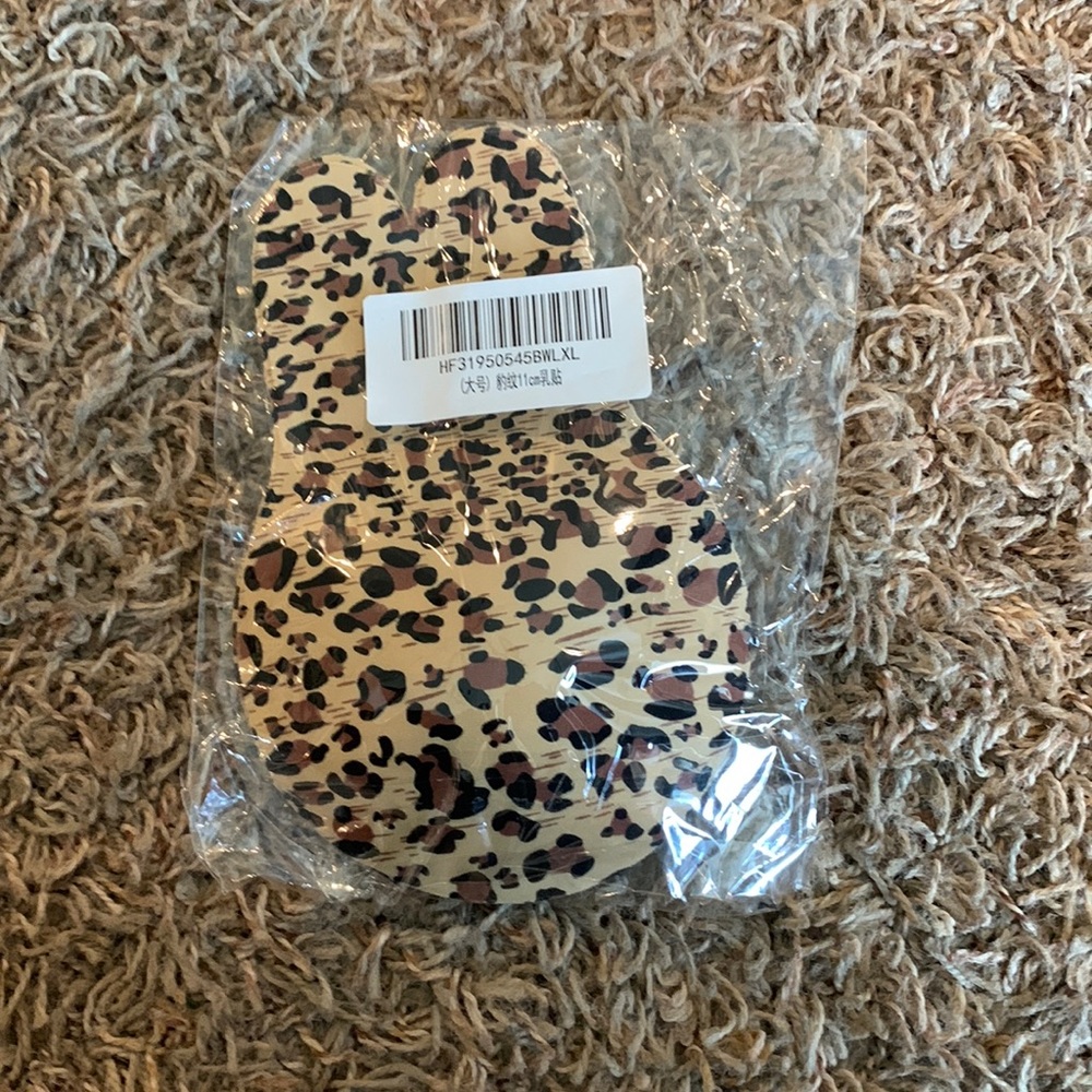 Tan and black adhesive bra size D